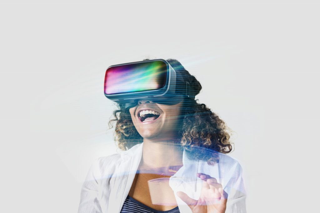 A businesswoman trying a VR headset in a trade show booth