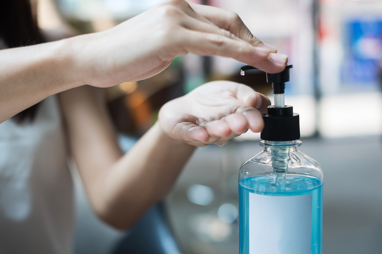 A large jar of hand sanitizer at an office