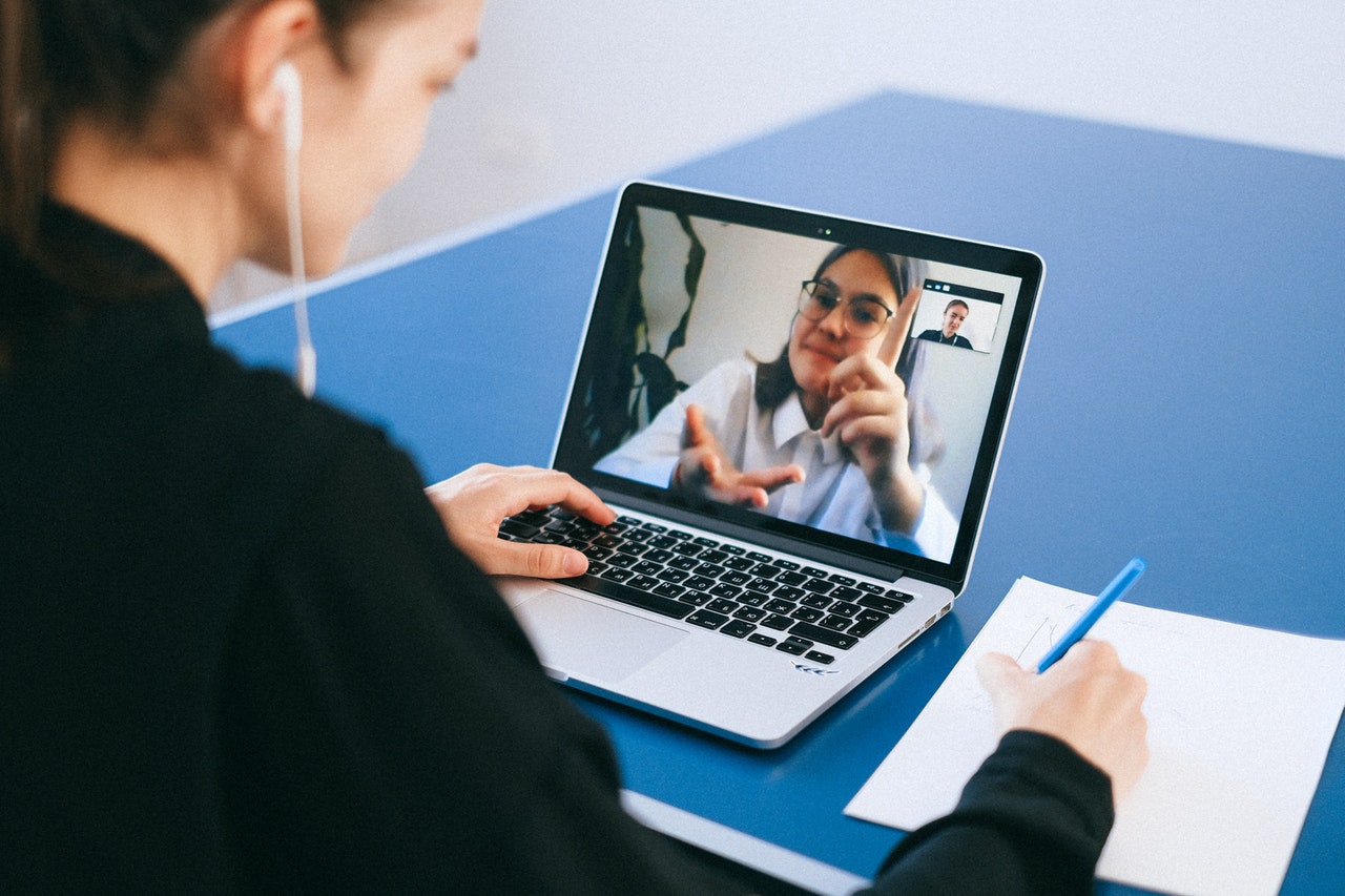 A woman asking questions at an online Q&A