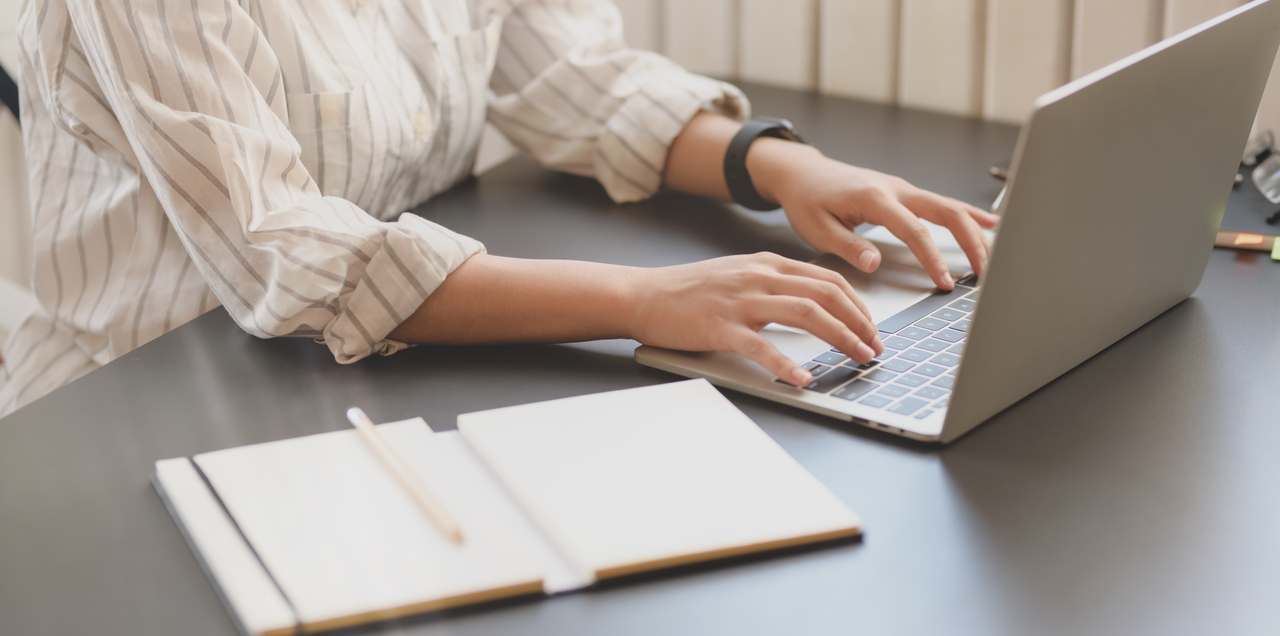 A woman creating a proposal letter for event sponsorships
