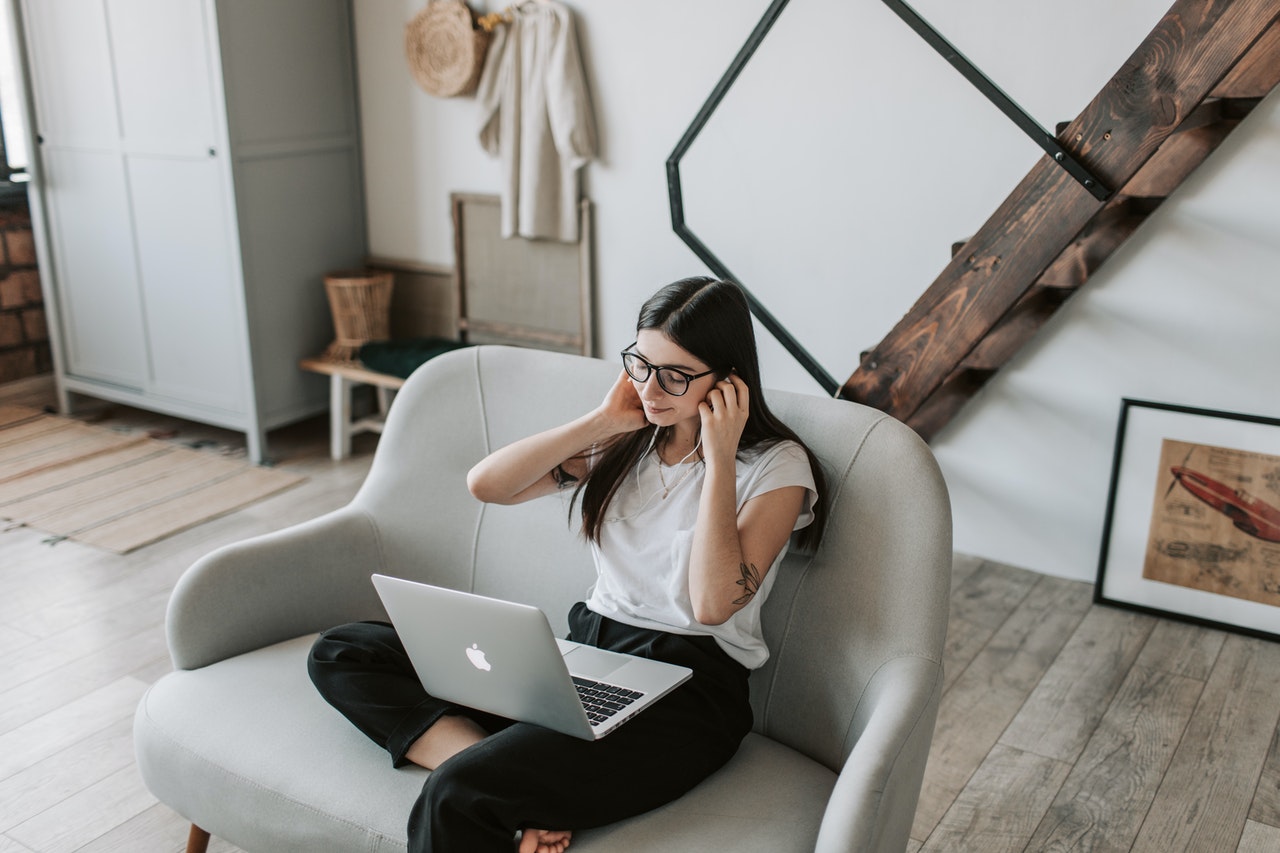 A woman attending a virtual event while at home